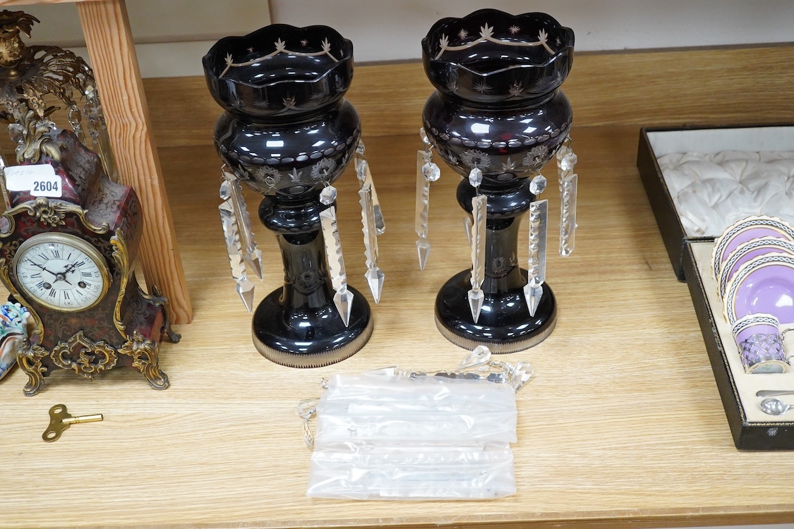A pair of 19th/20th century deep ruby flashed cut glass lustres, 36cm high